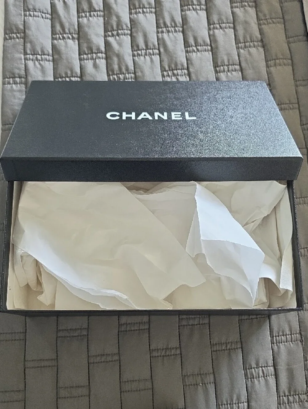 CHANEL Black Box with White Ribbon and Camellia Accent